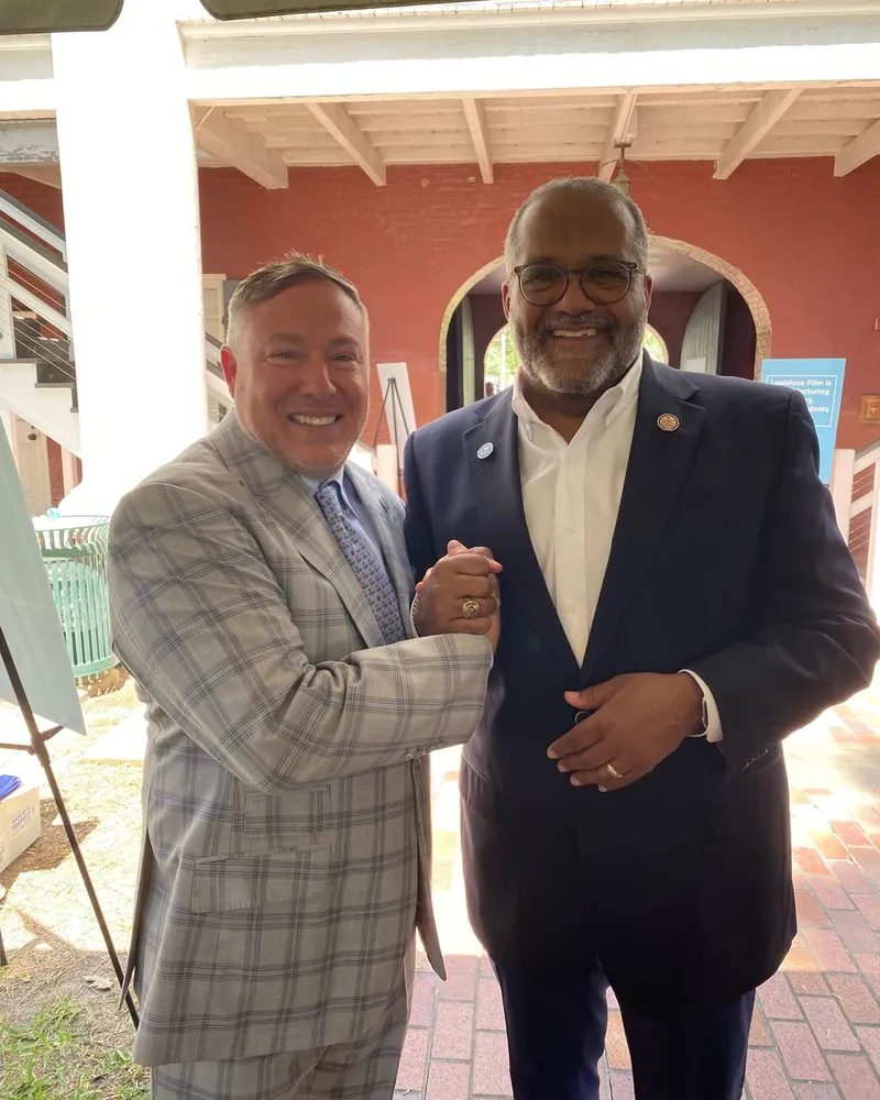 Tim Baudier greeting Congressman Troy Carter