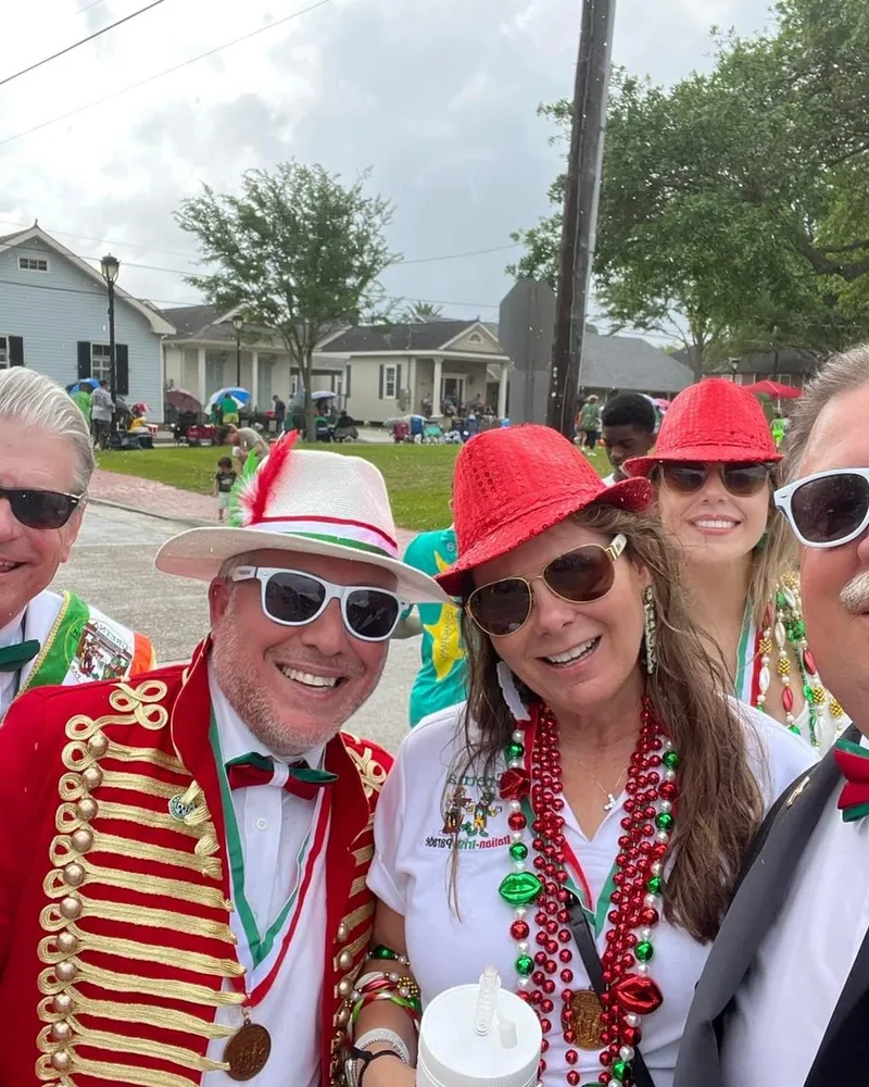 Tim Baudier with neighbors at a community parade celebration