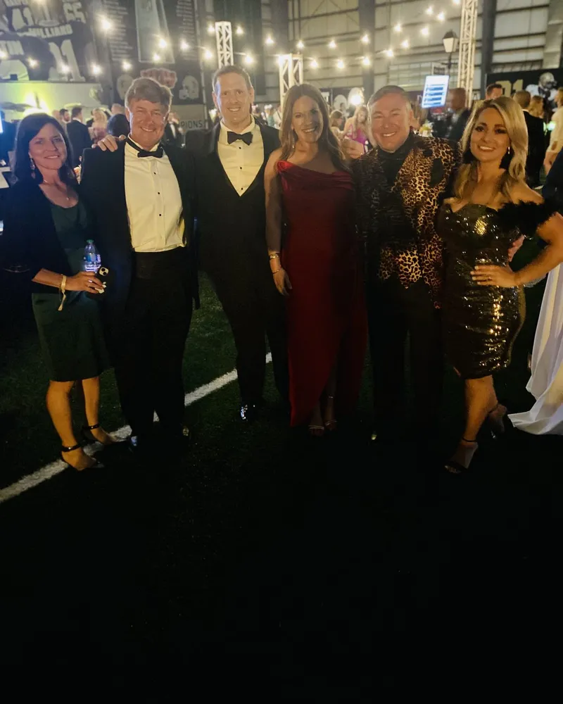 Tim Baudier with friends at a formal event in Jefferson Parish